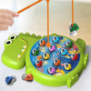 A green magnetic fishing toy set with several small plastic fish being caught by an orange fishing rod.