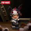 A collectible figure blind box of a small, dark-haired creature with large ears and white fur, set against a dark background.