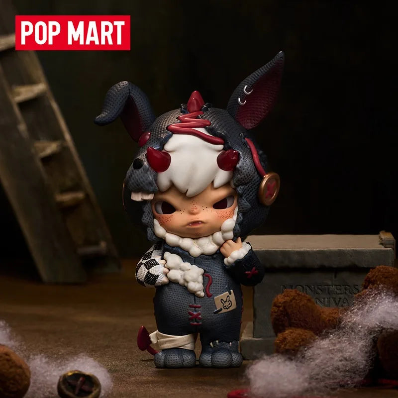 A collectible figure blind box of a small, dark-haired creature with large ears and white fur, set against a dark background.