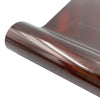 A roll of holographic glitter heat transfer vinyl in a reddish-brown color.