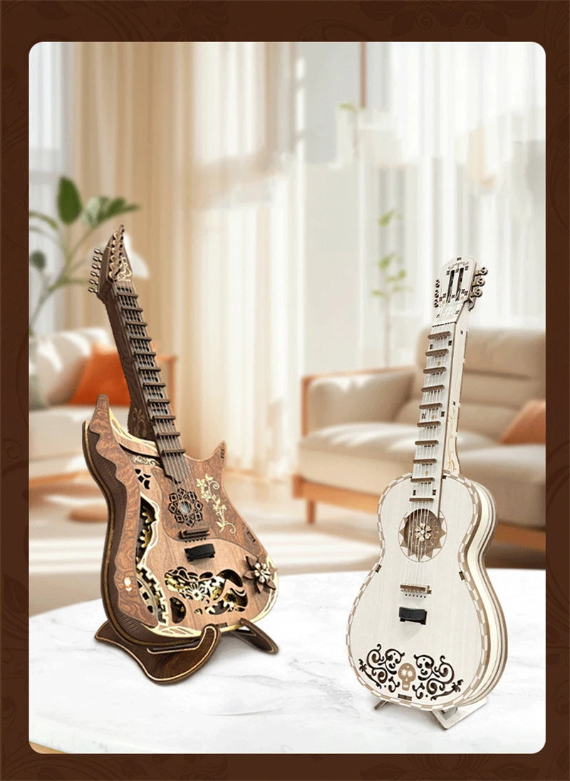 A detailed wooden miniature guitar model kit with intricate carvings displayed on a white marble surface.