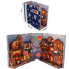 A DIY wooden book nook kit featuring a detailed Japanese alley miniature scene with illuminated buildings and seasonal foliag