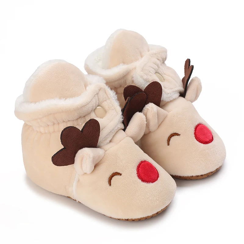 A pair of light beige baby winter cartoon boots with soft fur trim and a non-slip sole.