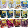 A collection of Dragon Shield card sleeves in various colors including red, purple, and green.