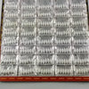 A sheet of 120 oval seven star fishing floats with bobber beads packaged in clear plastic.