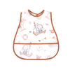 A white baby bib with a brown trim featuring a cartoon nautical pattern of sailboats and starfish.