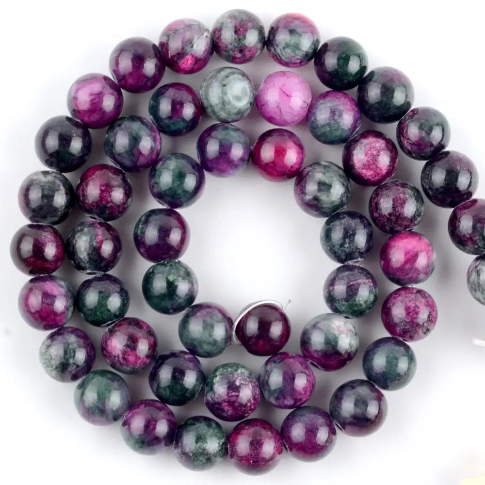 A strand of natural sea sediment jasper and turquoise beads for jewelry making