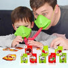 A man is using a green frog mask to catch a tongue-catching card game for a family party challenge.