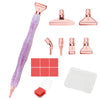 A set of pink resin diamond painting pens with interchangeable metal tips and multi-placers, including various sizes and a wh