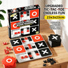 A box of a Tic Tac Toe board game with tiles and accessories is displayed on a wooden table.