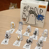 A collection of mini blind box figurines depicting cats in various poses and expressions.