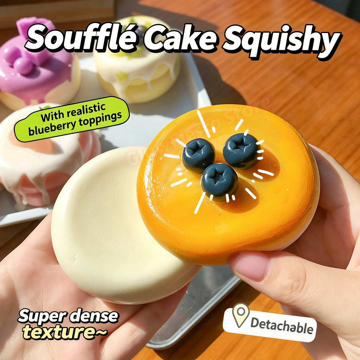 A hand holds an orange soufflé cake squishy with realistic blueberry toppings and a creamy yellow base.