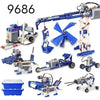A collection of blue and gray motorized building blocks and robots for STEM education.