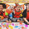 A collection of colorful sticky spider web and orange Halloween party favors for children.