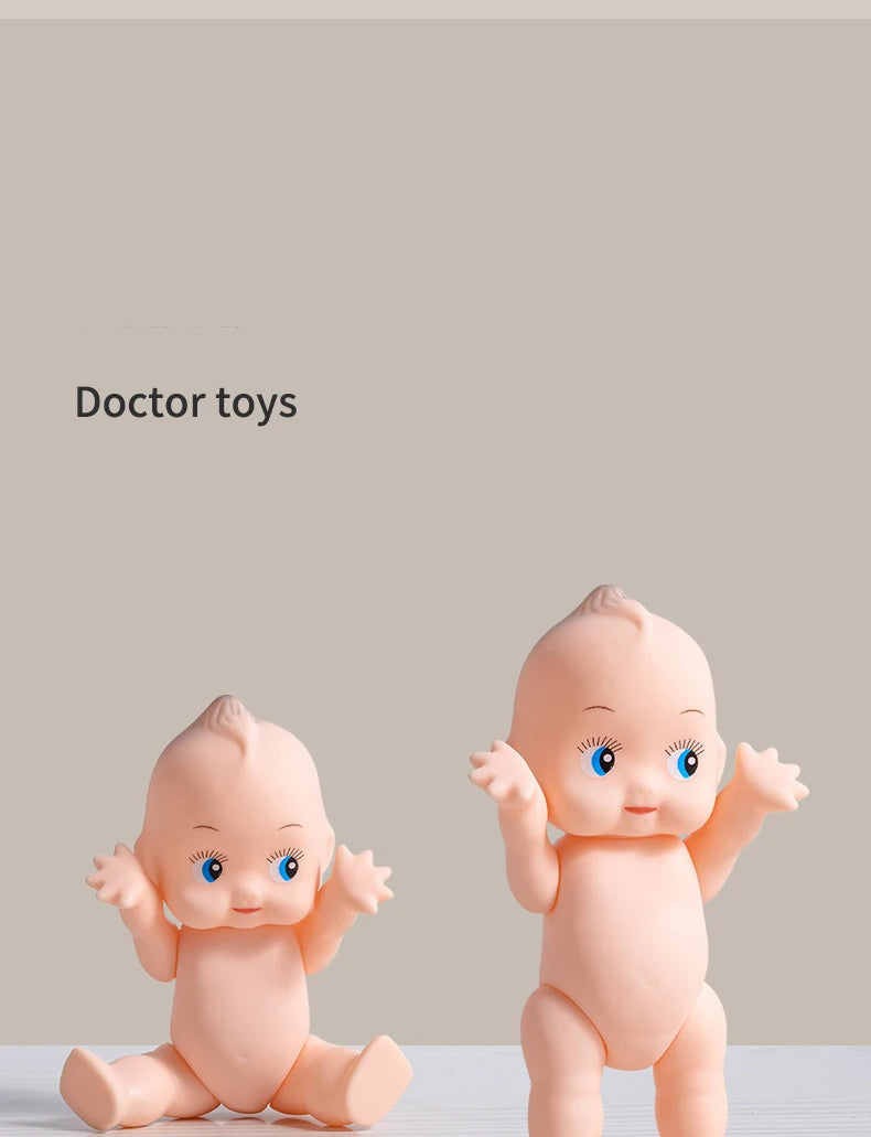 A pair of pink baby doctor toys, including a baby figure and accessories, are displayed against a neutral background.