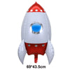 A red and white foil balloon shaped like a rocket or plane for birthday party decor