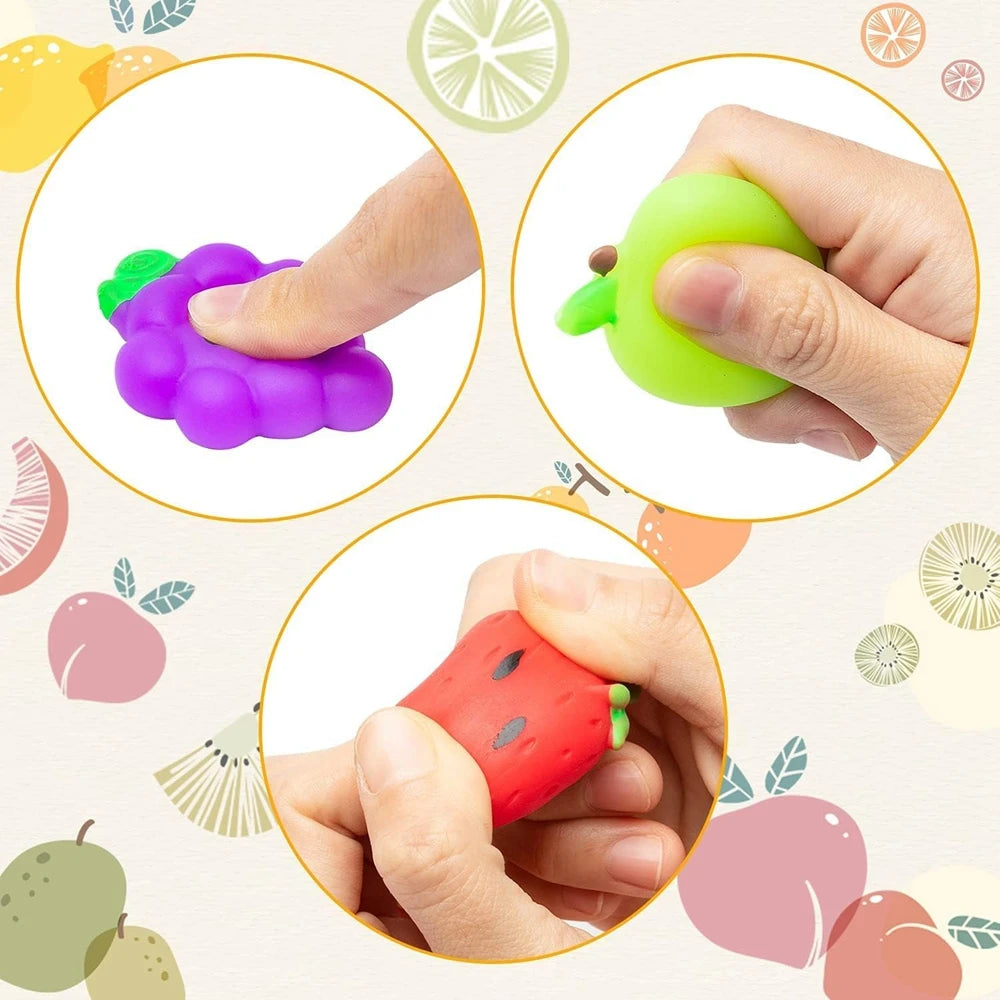 Three squishy toys shaped like a purple, green, and red fruit or vegetable are shown being squeezed by hands.