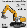 A yellow remote control model excavator in 1:64 scale with a tracked base and hydraulic arm.