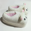 A pair of white Rilakkuma plush indoor slippers with pink accents.