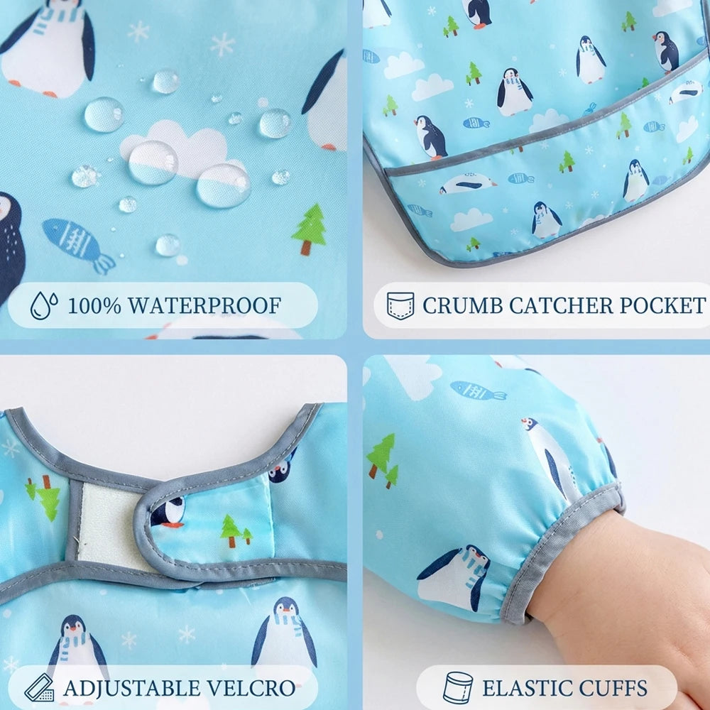 A set of light blue waterproof baby bibs with cute penguin designs, showing features like a crumb catcher pocket and adjustab