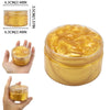 A jar of golden yellow glitter slime or putty is shown with measurements and hands for scale.