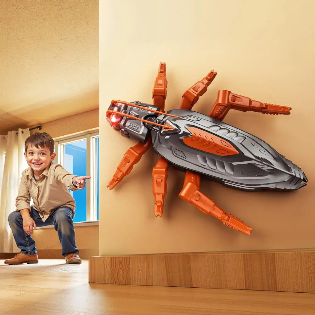 An orange and black wall-climbing RC gecko toy with glowing eyes is mounted on a beige wall.