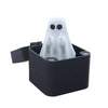 A black box containing a white ghost-shaped pop-up surprise gift with screws.