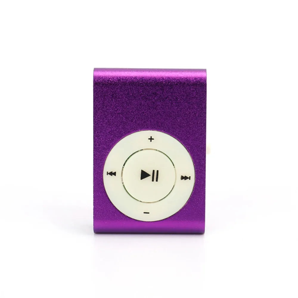 A purple portable mini MP3 player with a circular control dial.