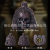 A dark bronze Aztec death whistle skull product shown from the front and side views.