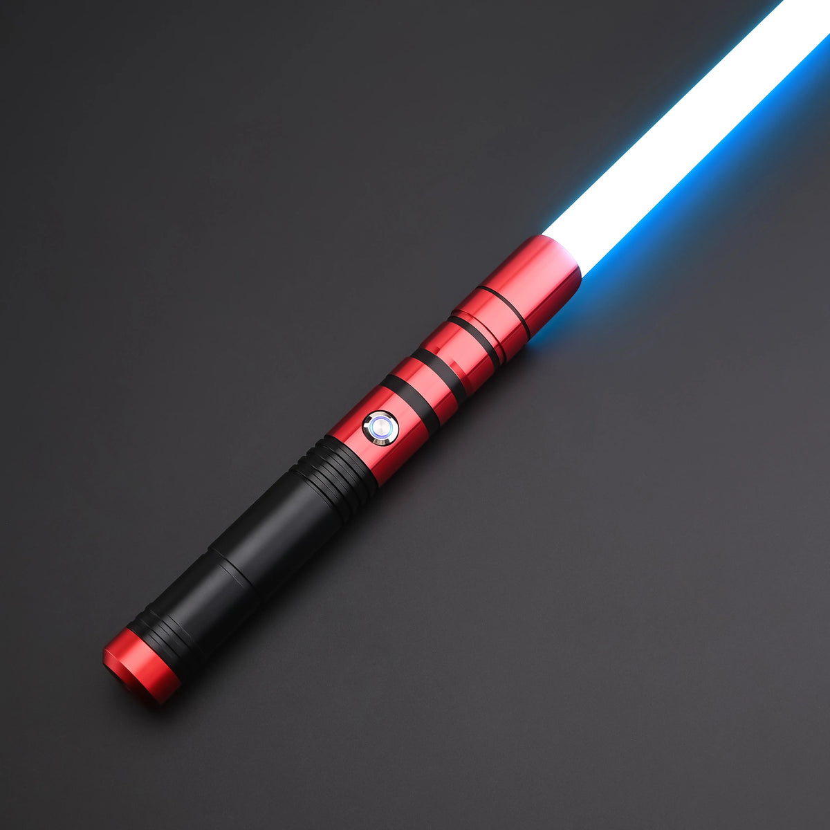 A white lightsaber with a red and black metal handle is shown against a dark background.
