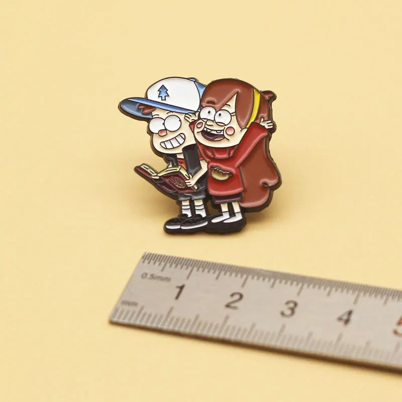 Enamel pin set featuring a boy and girl character from Gravity Falls for backpacks and jackets