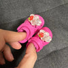 Pink fashion slippers for dolls decorated with white flowers and strawberries