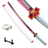 A replica bamboo katana with a pink handle, decorative flower guard, and sheath visible.