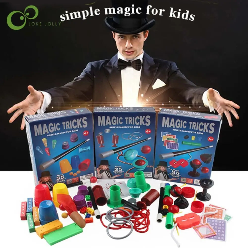 A magician in a tuxedo holds a box of magic tricks and various props including cards and tools.