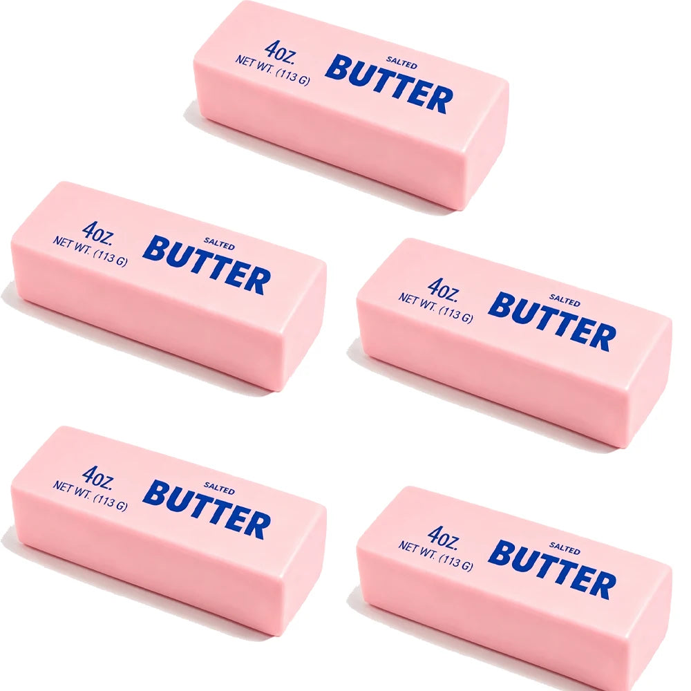 Four ounces of salted butter in pink rectangular sticks.
