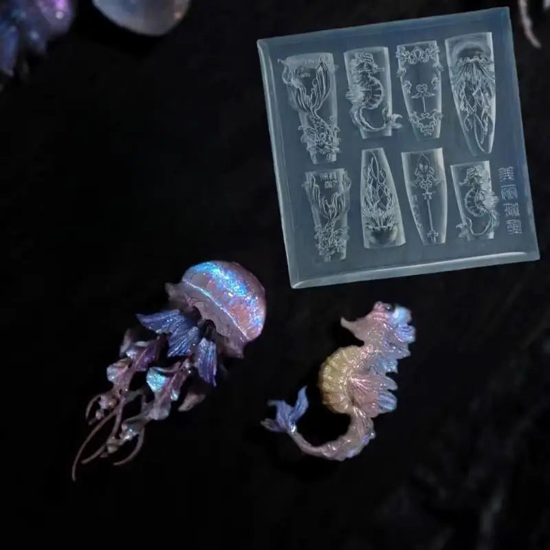 A clear silicone nail art mold featuring various sea shell, starfish, and ocean designs.