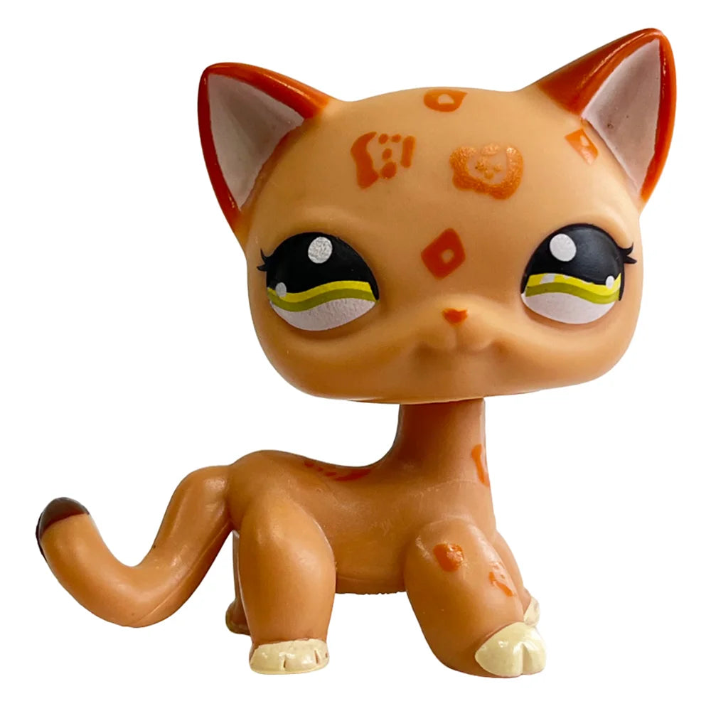 A charming bobble head pet figurine of an orange cat with white markings and large eyes.