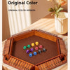 A wooden box game featuring a board and colored dice set on a wooden table.
