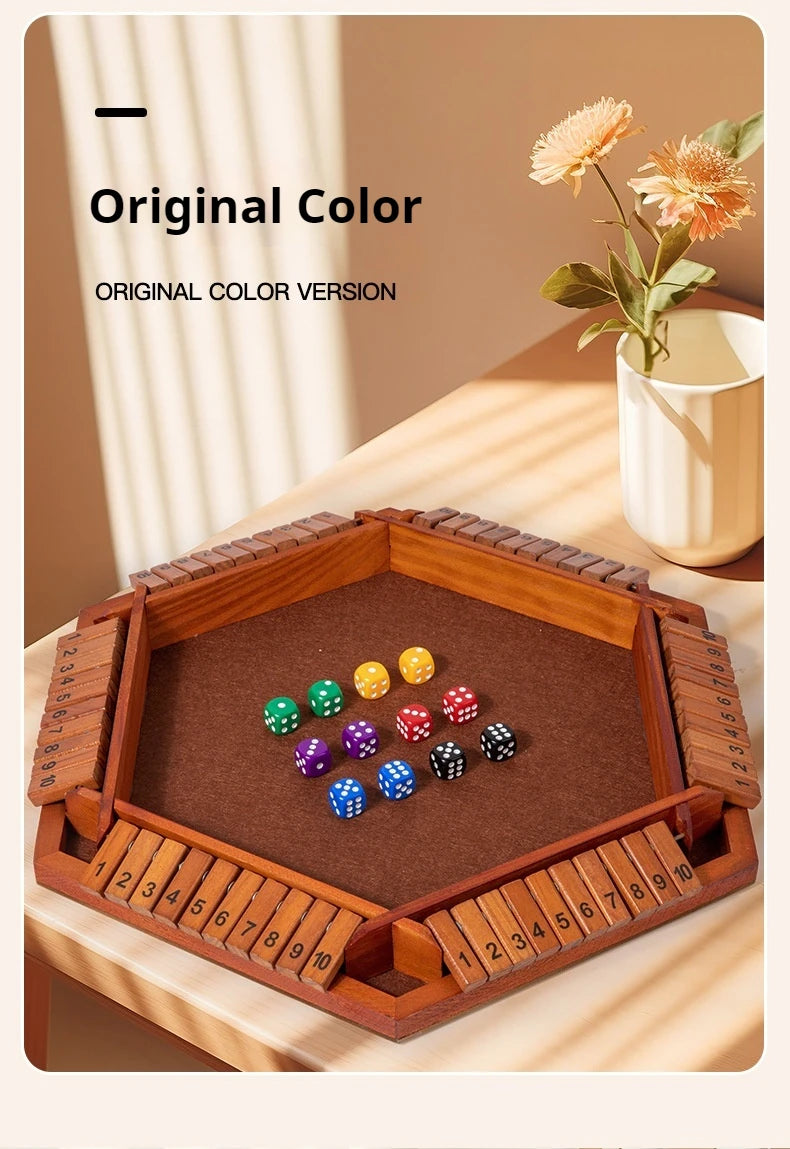 A wooden box game featuring a board and colored dice set on a wooden table.