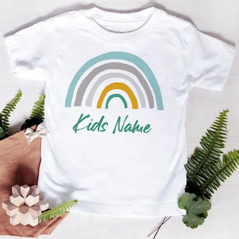 White t-shirt featuring a rainbow graphic design and the text Kids Name printed on the chest.