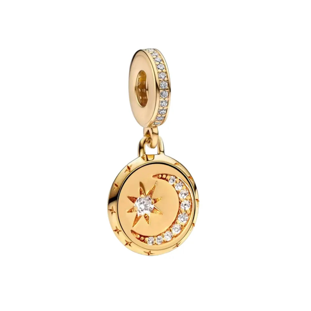 Gold-toned charm bracelet featuring pendants of an elephant, key, butterfly, and heart.