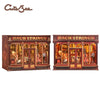 A pair of decorative wooden book string display boxes featuring antique books and musical instruments.