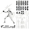 A clear plastic action figure and various magnetic accessories including hand parts, weapons, and armor pieces.