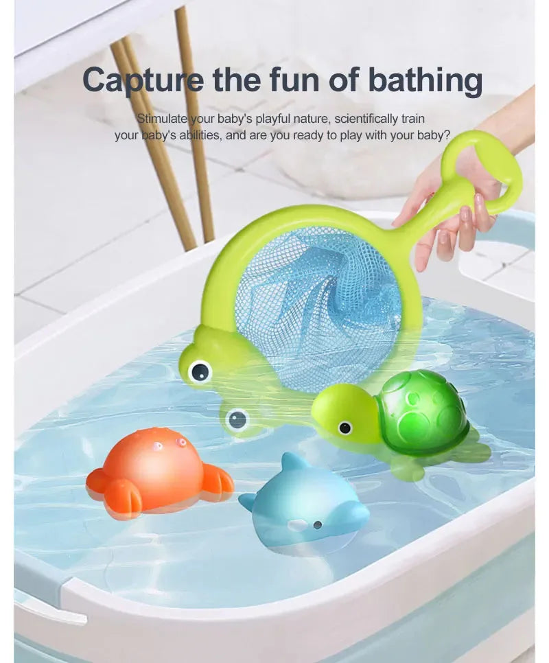 A green silicone bath toy set with a light-up scoop and several colorful bath toys floating in water.