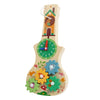 A wooden busy board featuring a house design and various musical activities for children.