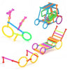 Colorful stick building blocks including a ramp, a house structure, and pairs of goggles.