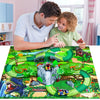 A boy is interacting with a green dinosaur race car track set featuring various dinosaurs and terrain.