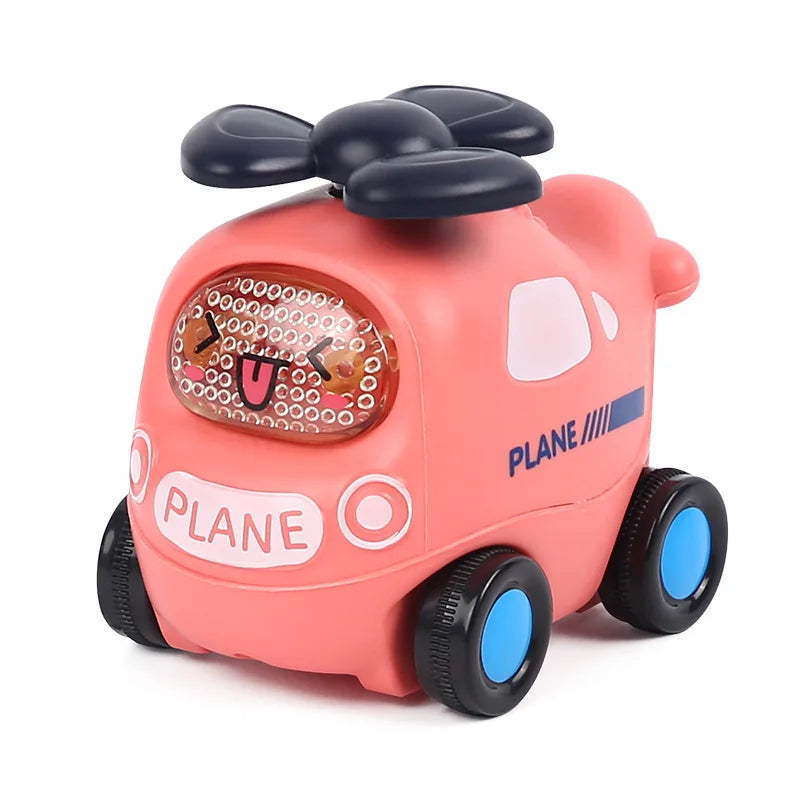 A pink rubber push and go toy car with black ears, featuring a rattle mechanism for babies.