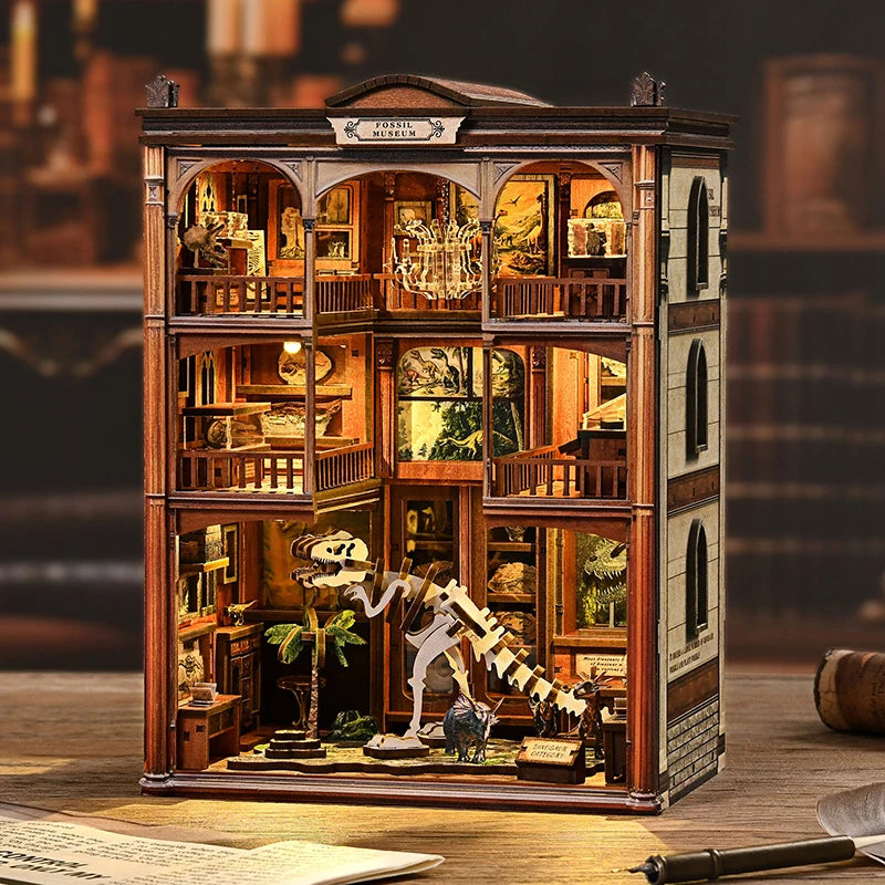 A detailed wooden model kit of a fossil museum with glass display cases and internal dioramas.