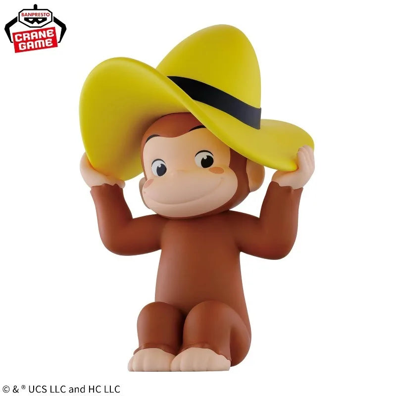 A collectible figure of Curious George wearing a yellow cowboy hat and brown fur.